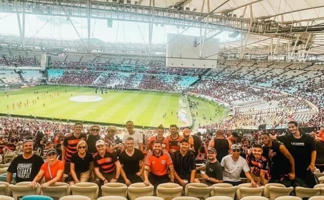 A group of guests in Flamengo shirts in the stands of the Maracanã